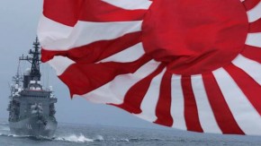 JMSDF escort ship Kurama, left, navigates behind destroyer Yudachi with a flag, during a fleet review in water off Sagami Bay