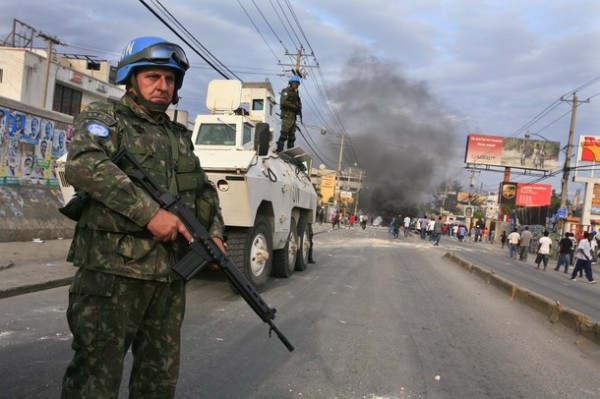 Brazilian U.N. Soldiers stand guard during a protest in Port-au-Prince