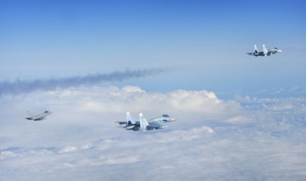 Image of two Russian SU-27 Flanker aircraft, seen with a RAF Typhoon fighter (distant). RAF Typhoons were yesterday (Tuesday 17 June) scrambled to intercept multiple Russian aircraft as part of NATO?s ongoing mission to police Baltic airspace. The Typho