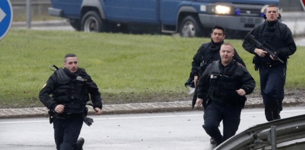 Members of the French gendarmerie intervention forces arrive at the scene of a hostage taking at an industrial zone in Dammartin-en-Goele, northeast of Paris