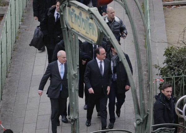 French President Francois Hollande arrives after a shooting at the Paris offices of Charlie Hebdo, a satirical newspaper