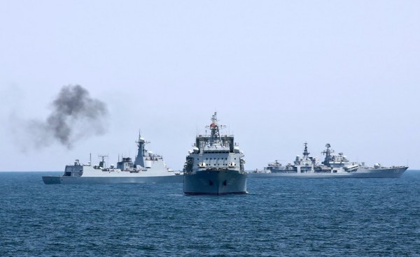 Chinese and Russian naval vessels are seen during Joint Sea-2014 naval exercise outside Shanghai on the East China Sea, May 23, 2014. China's East Sea Fleet and Russia's Pacific Fleet together sent 14 warships, two submarines, nine warplanes, six helicopters and two special forces to their third joint naval exercise that is expected to last until May 26, according to the official Xinhua news agency. REUTERS/China Daily (CHINA - Tags: MILITARY POLITICS MARITIME) CHINA OUT. NO COMMERCIAL OR EDITORIAL SALES IN CHINA - RTR3QJZB