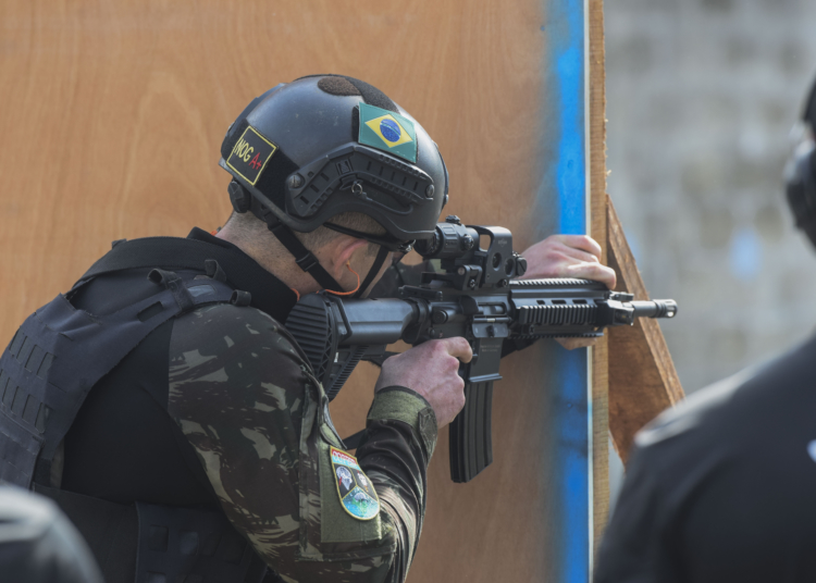 A Brazilian comando shoots targets as part of Fuerzas Comando, July 18, 2018 at the Instituto Superior Policial, Panama. Partner nations participating in Fuerzas Comando refine their tactical and technical skills during competition. By increasing their special operation capabilities, countries become more capable of confronting common threats. (U.S. Army Photo by Staff Sgt. Brian Ragin/Released)