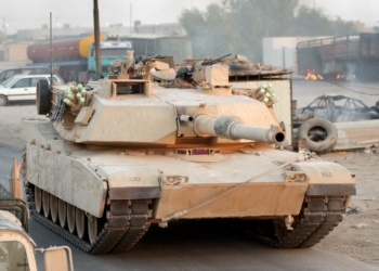 A U.S. Marine Corps M1 Abrams Main Battle Tank (MBT), 11th Marine Expeditionary Unit (MEU), Special Operations Capable (SOC), in convoy along the streets of An Najaf, An Najaf Province, Iraq, on Aug. 12, 2004, during a raid of the Muqtada Militia strong points in the area.  (U.S. Marine Corps photo by Cpl. Daniel J. Fosco) (Released)