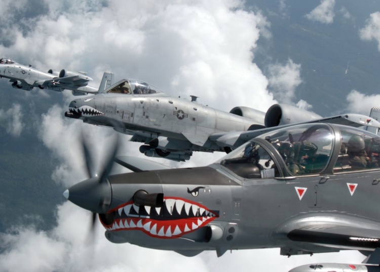 A Colombian Air Force A-29B Super Tucano flies alongside two U.S. Air Force A-10 Thunderbolt IIs from the 75th Fighter Squadron, Moody Air Force Base, Ga., during Exercise Green Flag East Aug. 21, 2016. Colombia and U.S. share a special relationship, and the joint training exercise provides a platform to strengthen those ties. Four Colombian A-29s and 45 Colombian Airmen are at Barksdale Air Force Base, La., through Aug. 29. (Photo courtesy Colombian Air Force)